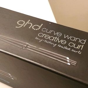 Only used once. GHD curve hair curler. Comes with hand gloves and mini tip book